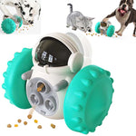 A pet toy shaped like an astronaut with large teal wheels and a black visor, shown on a white background with small inset photos of a dog, cat, and dog eating kibble near the toy.